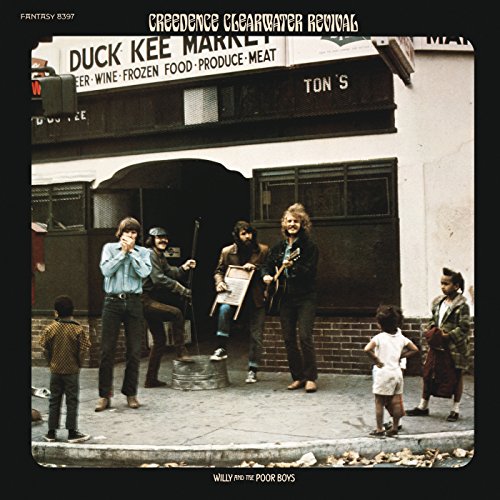 Creedence Clearwater Revival album cover featuring band and storefront scene.