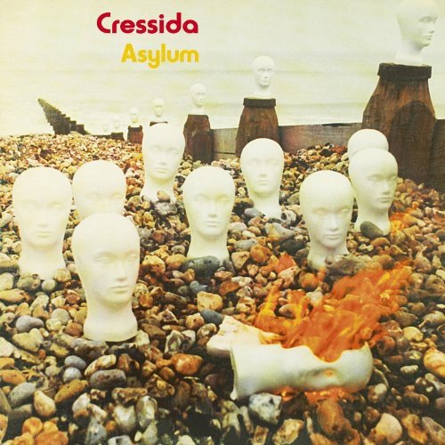 "Album cover with white mannequin heads on pebbles, one burning, with text 'Cressida Asylum'."