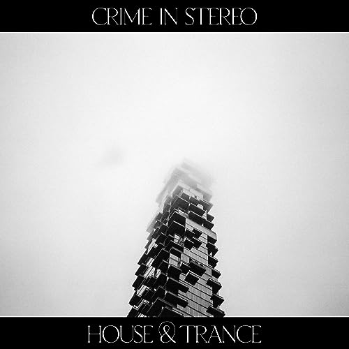 Black and white vinyl record cover with a tall building in fog.