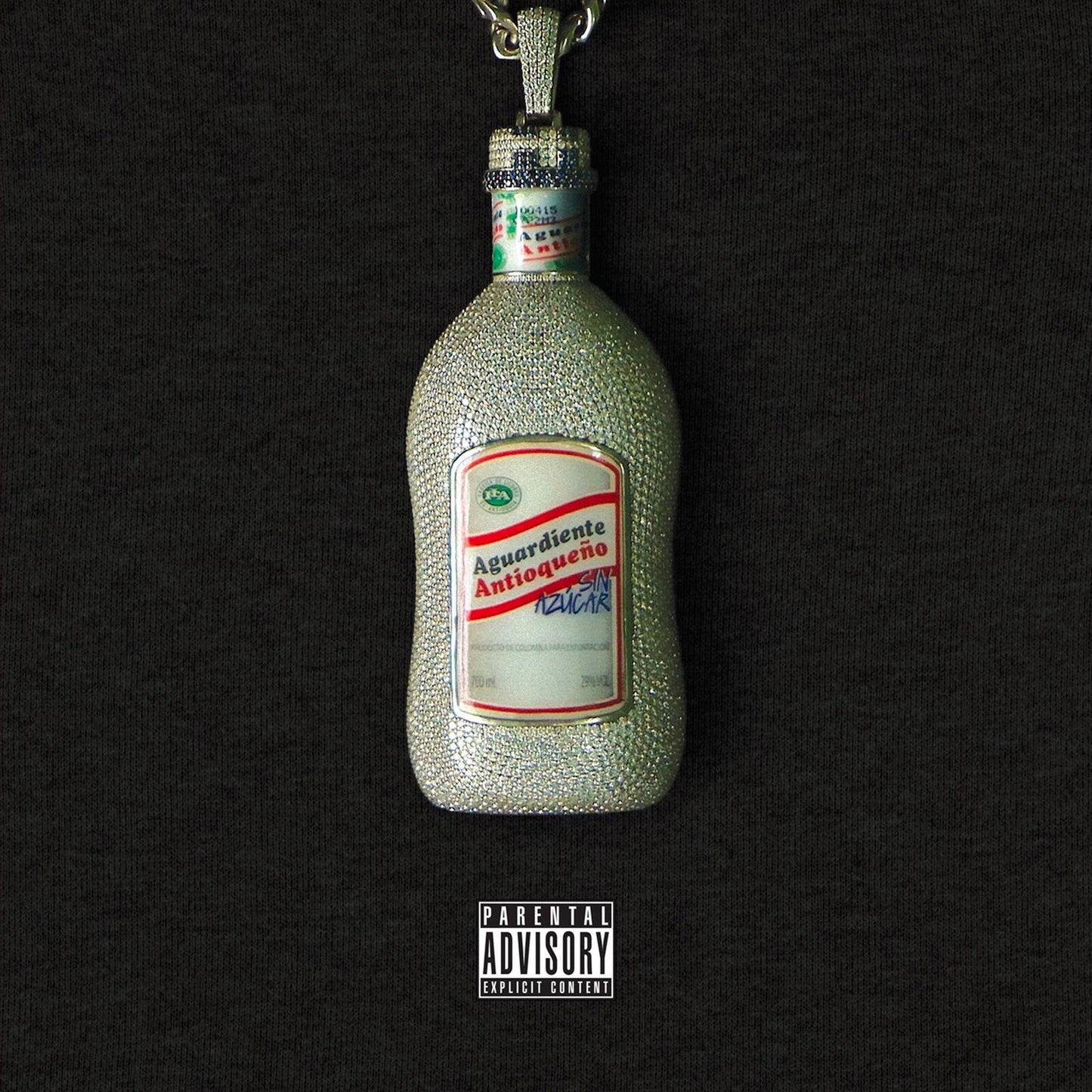 Diamond-encrusted bottle of “Aguardiente Antioqueño” against a black background.