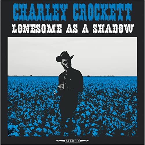 Charley Crockett album cover: man in a field under a blue sky.