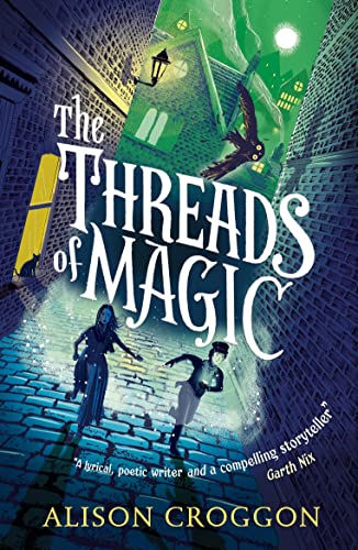 Book cover: "The Threads of Magic" with figures in a cobbled street.
