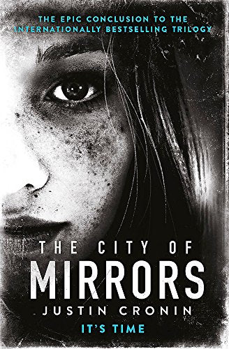 Book cover: close-up of a woman’s face with the title “The City of Mirrors.”