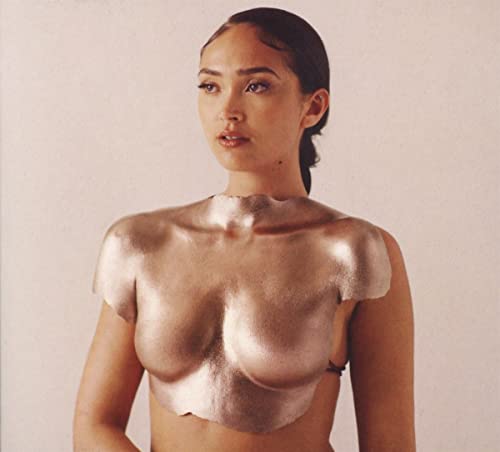 CD cover featuring a woman with gold paint on her upper body.