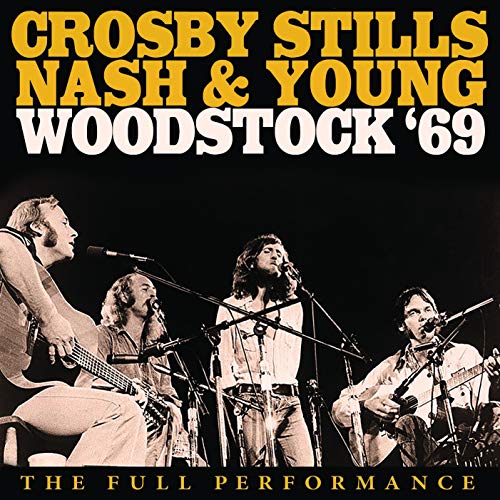 Crosby, Stills, Nash & Young performing live on stage at Woodstock in 1969.