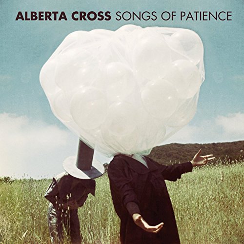 Album cover with two figures and a large cluster of white balloons.