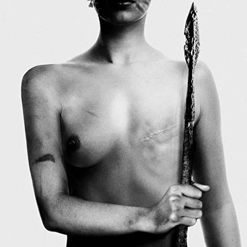 Black and white image of a shirtless person holding a spear against a white background.
