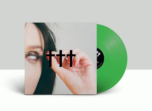 Vinyl record cover showing a close-up of a face with a bright green disc.