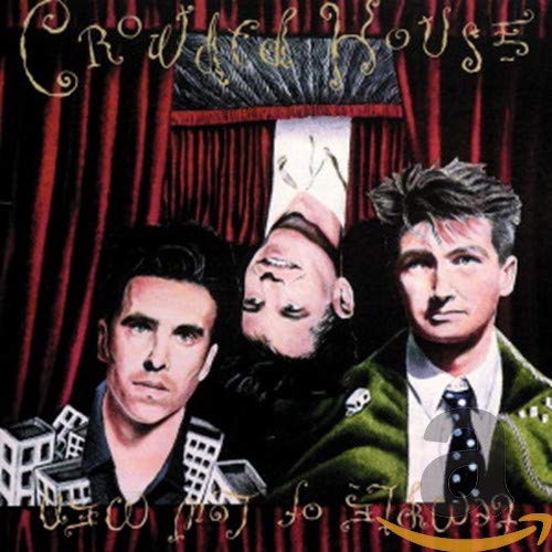 Crowded House album cover: three men in front of red curtains.