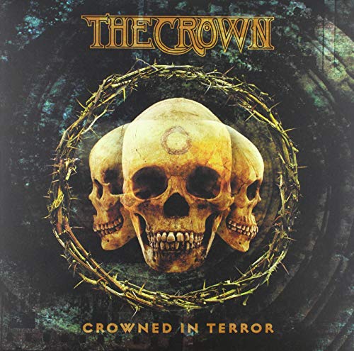 "Album cover featuring three skulls surrounded by a thorny crown, dark background."
