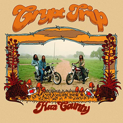 Album cover: three people on motorcycles framed by armadillos and barbed wire.