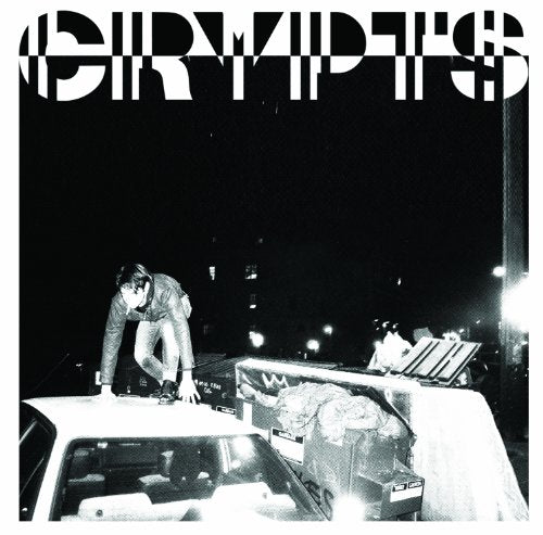 Black and white album cover with a person on a car roof.