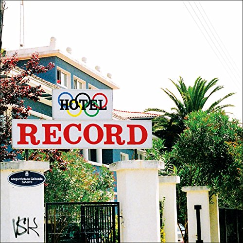 Hotel Record album cover featuring a blue building and colorful sign.
