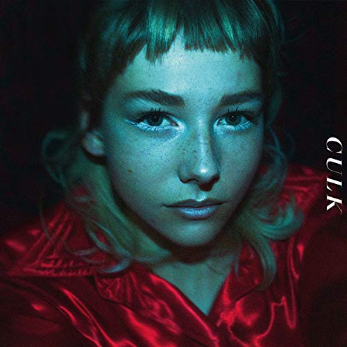 CD cover: close-up portrait of a young woman with blue and red lighting.