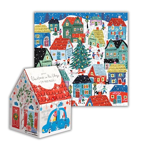Colorful jigsaw puzzle depicting a snowy village scene with houses and a tree.