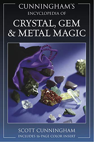 Book cover featuring crystals, gems, and a purple silk cloth.