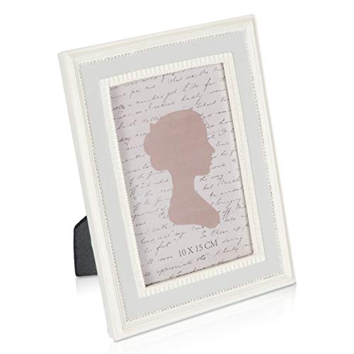 White picture frame with a silhouette and handwritten text inside.