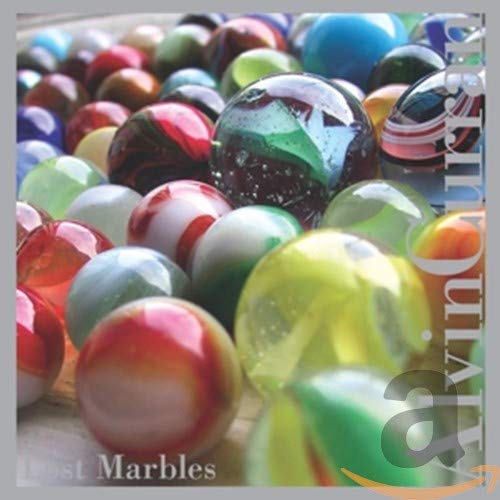 Close-up of colorful glass marbles with album title overlayed.