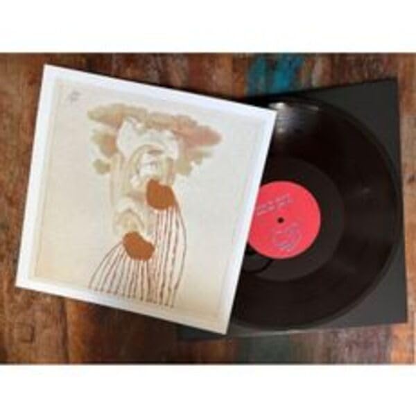 Vinyl record and album cover with a sketched figure in sepia tones.