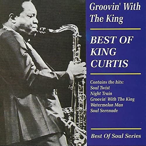 King Curtis plays saxophone on album cover, “Groovin’ With The King.”