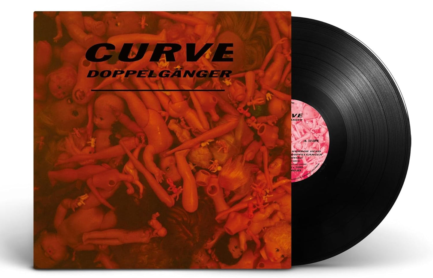 Curve Doppelgänger vinyl record with cover art featuring a pile of orange plastic dolls.