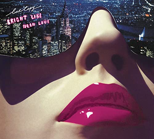 Cut Copy album cover: city skyline with a close-up of bright pink lips.