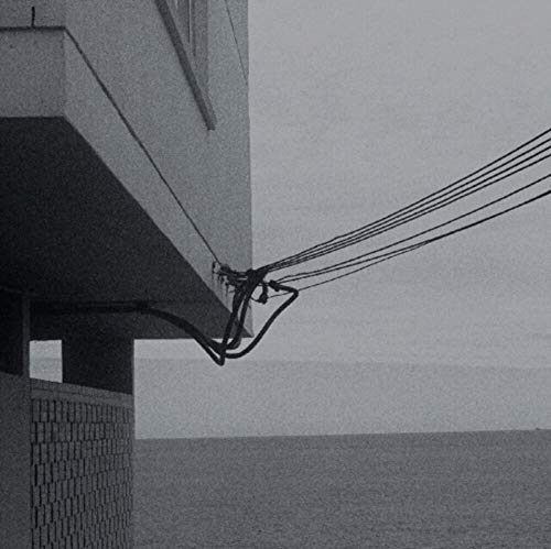 Black and white album cover depicting building facade and power lines.