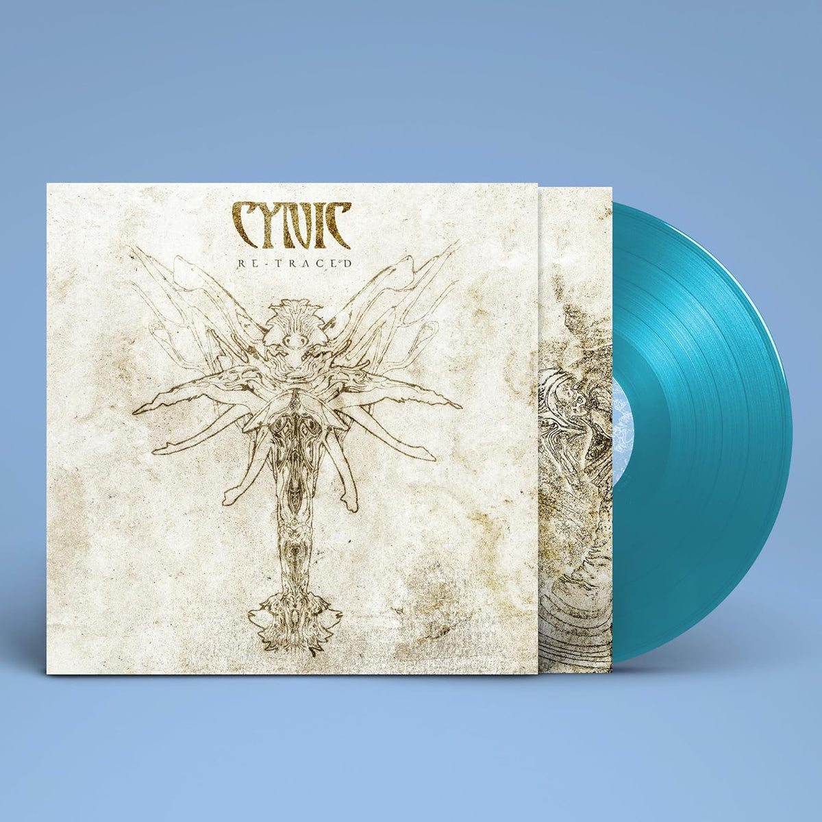Cynic "Re-traced" vinyl record with ornate cover art and blue disc.