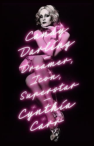 Candy Darling portrait with pink neon text on a dark background.