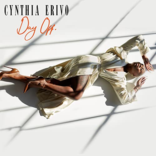 Cynthia Erivo album cover: woman in white dress lying in sunlight.