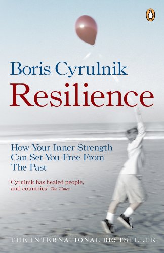 Book cover: boy releasing a red balloon on a beach.