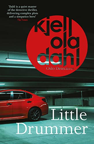 Book cover: red circle, car in parking garage, title “Little Drummer”.