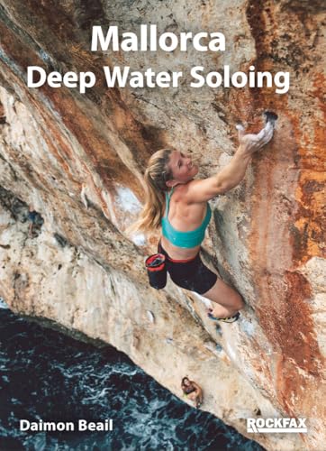 A climber scales a sea cliff above water on the cover of a guidebook.