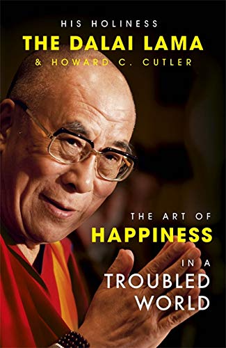 Book cover featuring the Dalai Lama smiling, with yellow and white text.