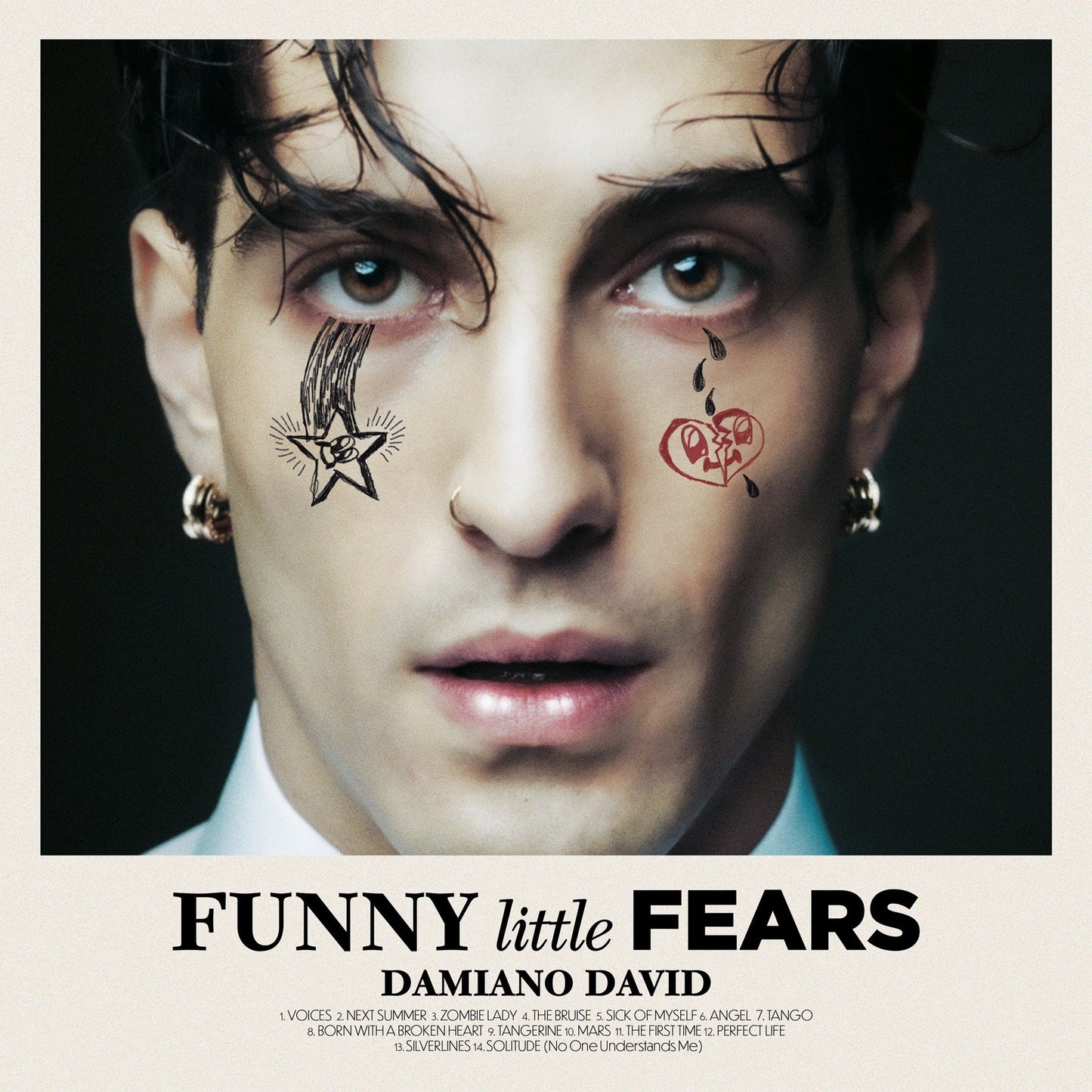 Damiano David album cover with painted face, text, and tracklist below.