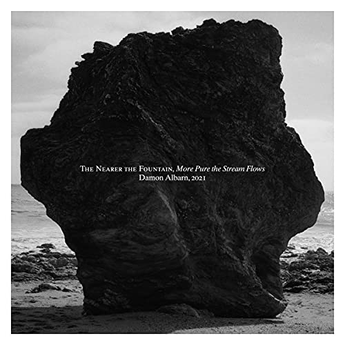 CD album cover: a dark, textured rock formation by the sea.