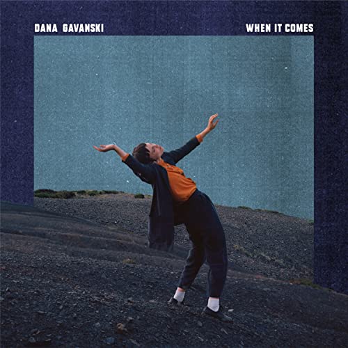 "Album cover featuring a person in a dynamic pose on a rocky surface."