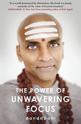 Book cover featuring a portrait of Dandapani with white forehead markings and prayer beads.