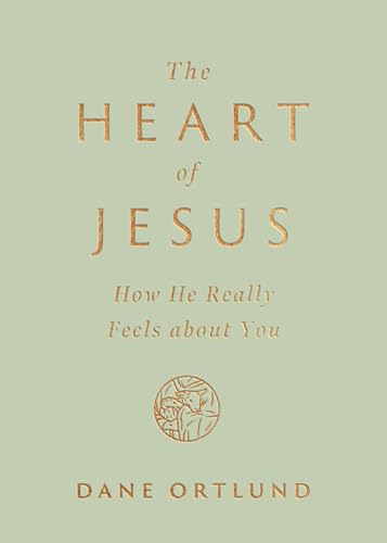 Book cover with golden text: "The Heart of Jesus" and a circular design.