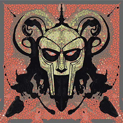 Black and gold mask with horns on an orange speckled background.