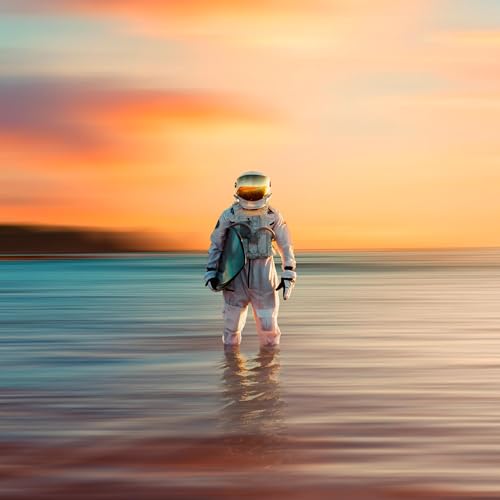 An astronaut holding a surfboard stands in the ocean at sunset.
