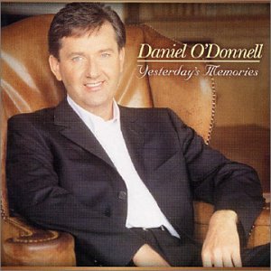 Daniel O'Donnell album cover, man in suit seated in armchair.