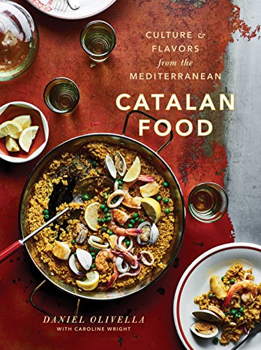 Book cover showing a pan of seafood paella on a rustic red table.