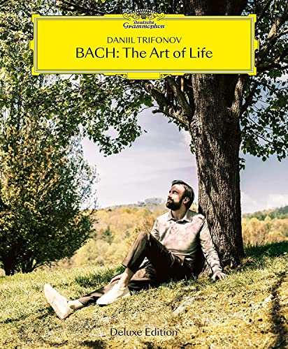 CD cover featuring pianist Daniil Trifonov sitting beneath a tree.
