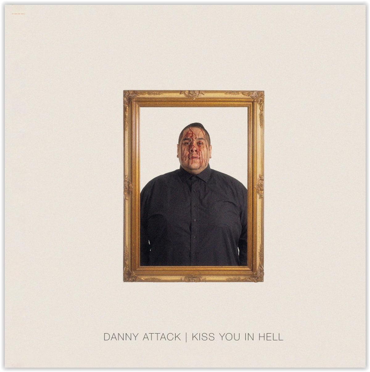 Man with blood on face framed in ornate gold, album cover.