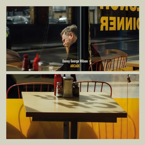 Album cover for Danny George Wilson’s “Arcade” featuring a man and diner scene.