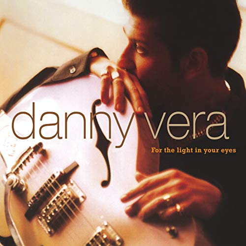 Danny Vera album cover featuring a man with a guitar.