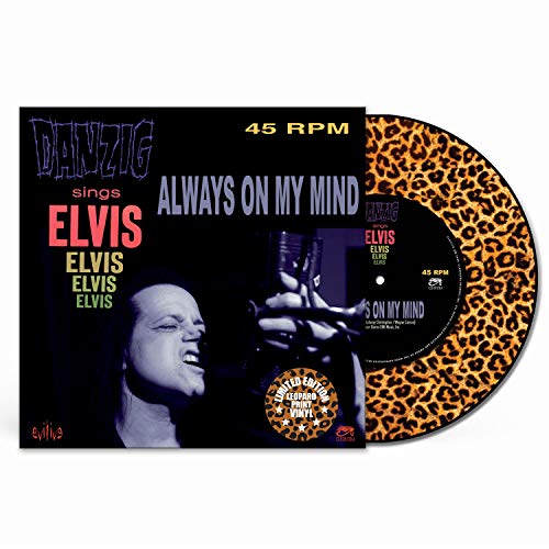 Vinyl record cover with Danzig singing into a microphone, colorful text overlay.