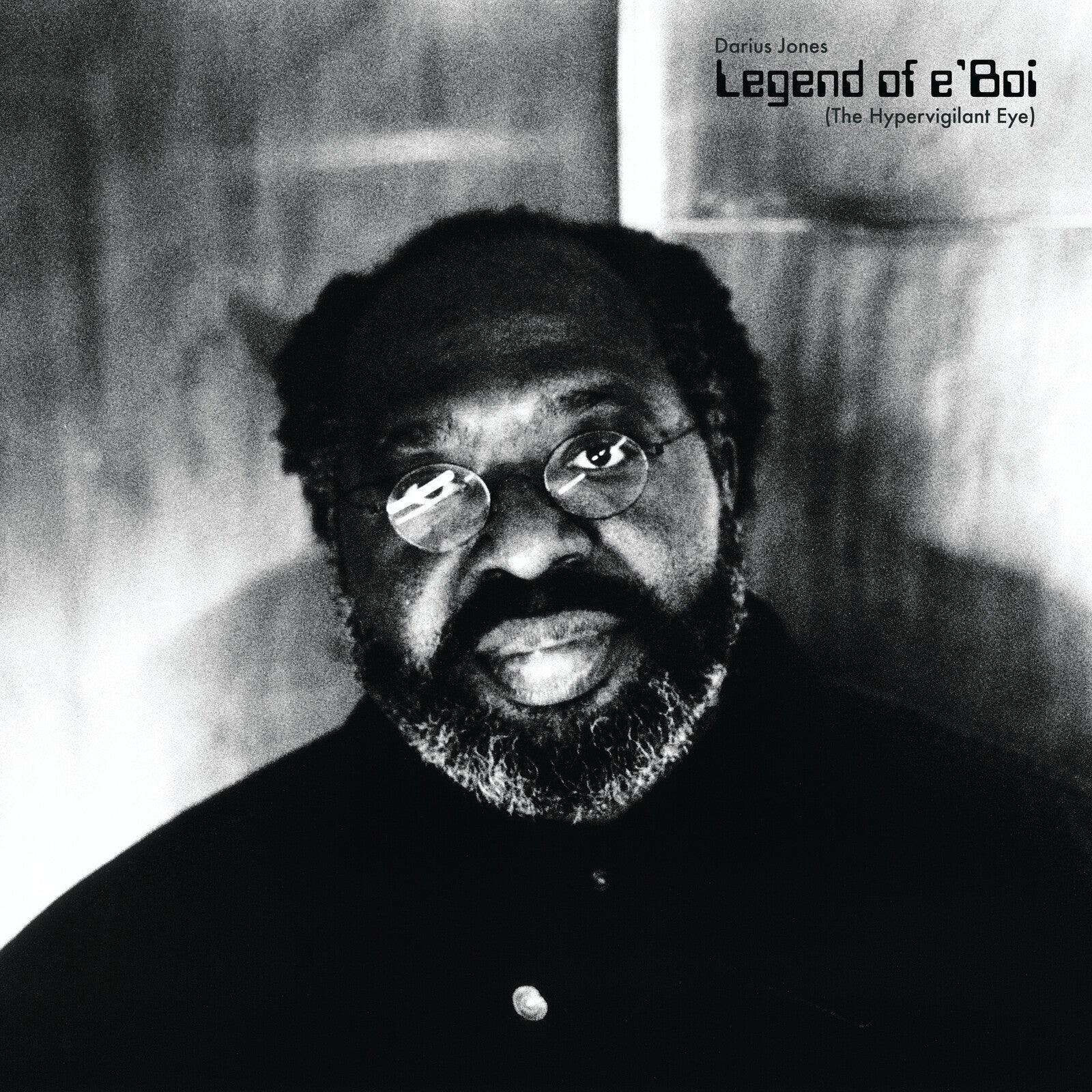 Black and white CD cover featuring portrait of Darius Jones with glasses.