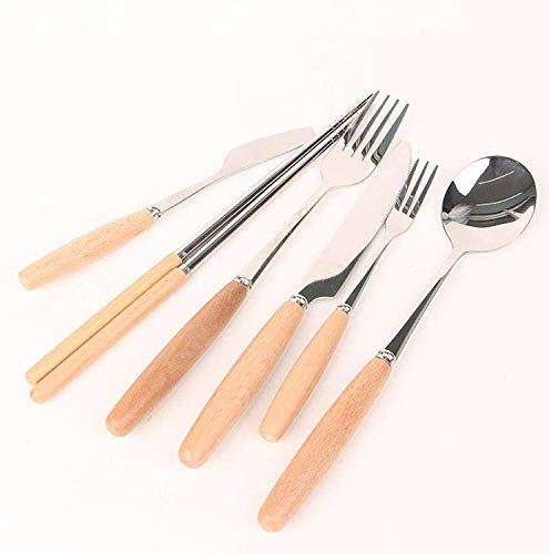 Silver cutlery set with light wood handles arranged on a white surface.